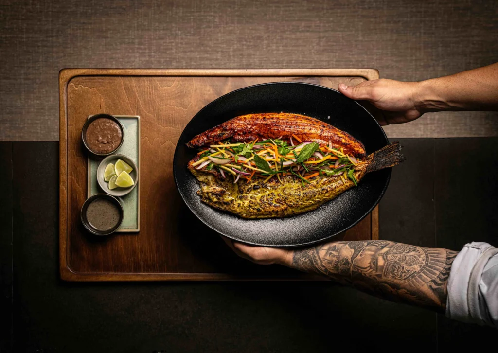 lubina a la talla con adobo rojo de chile guajillo y adobo verde de chile poblano